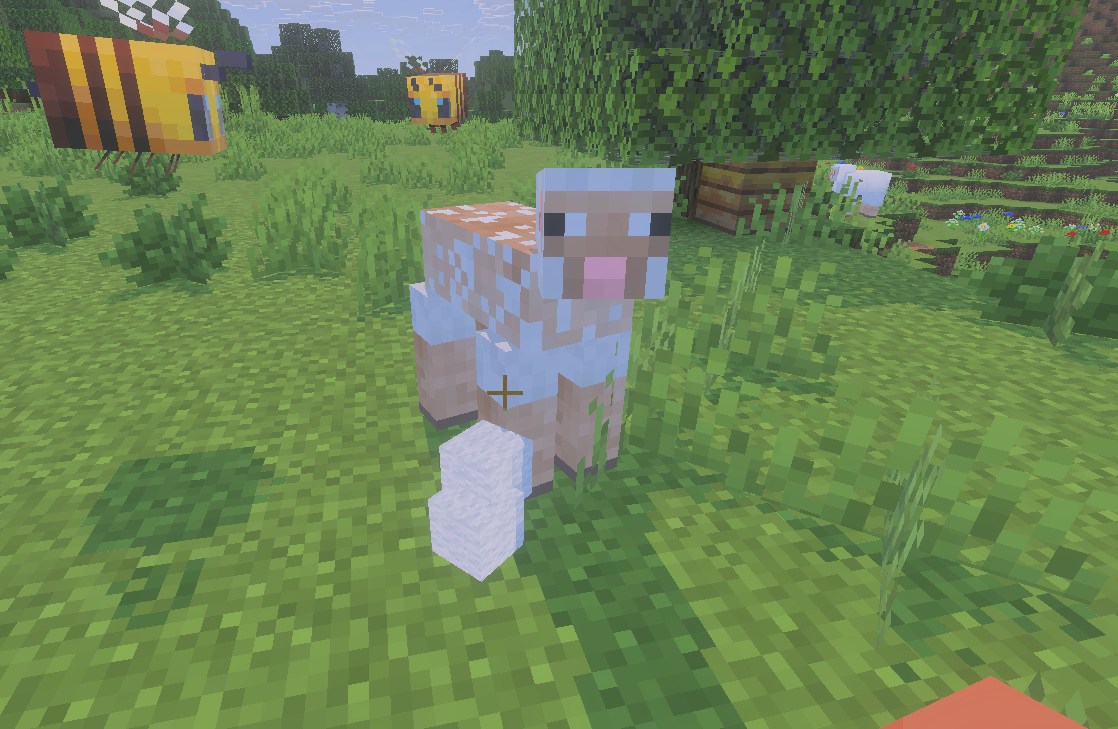 マイクラで羊にハサミを使ってクッションの材料の羊毛を集めるところ