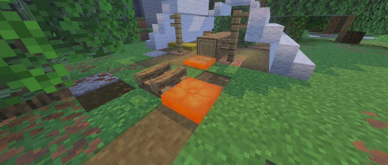 マイクラの放棄されたキャンプで焚き火のまわりに置かれているクッション