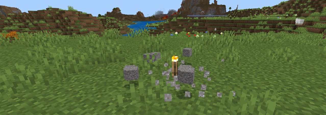 マイクラで積み重なった砂利の下にたいまつを置いてまとめてくずす様子